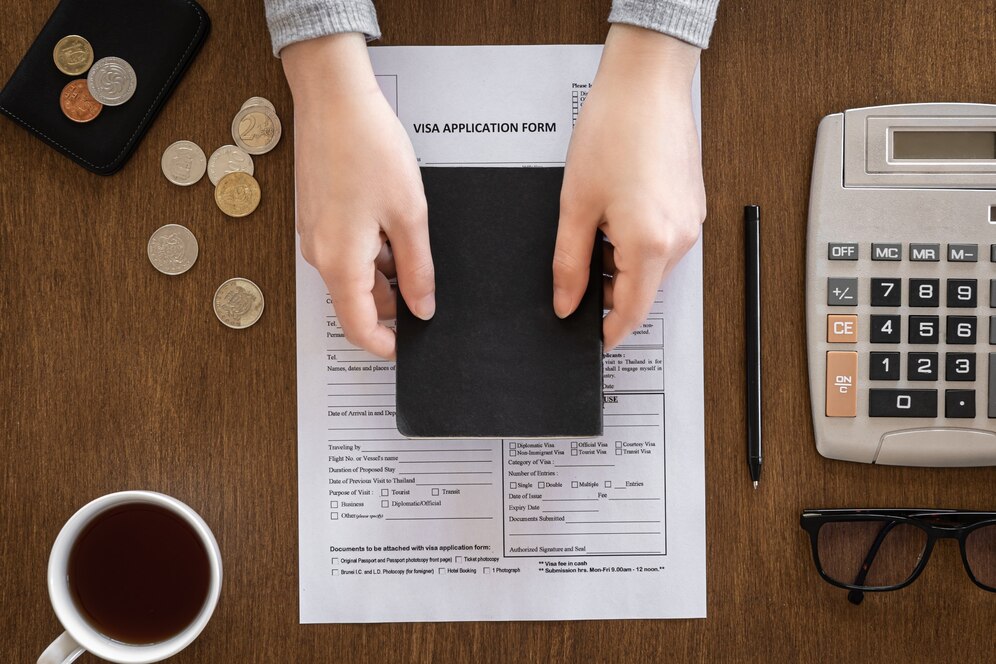 visa-application-form-wooden-table-visa-processing-registration-flat-lay_169016-16159